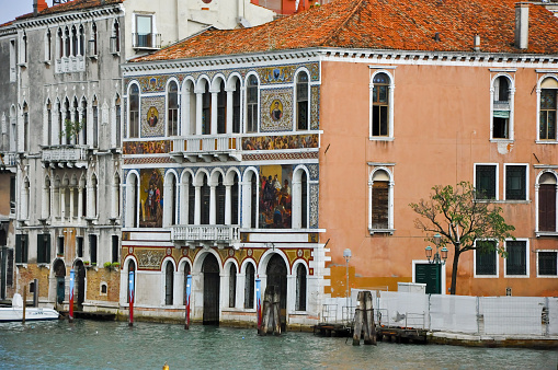 Venice, Italy - July 23, 2010: The Grand Canal in Venice with colorful medival buildings along the side in Venice. 
