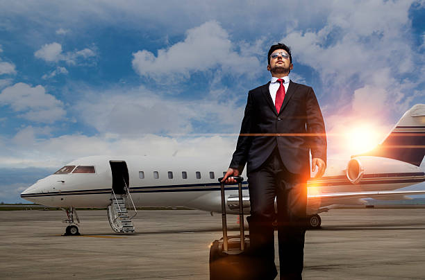 istock Businessman walking away from private jet after flight 618059818
