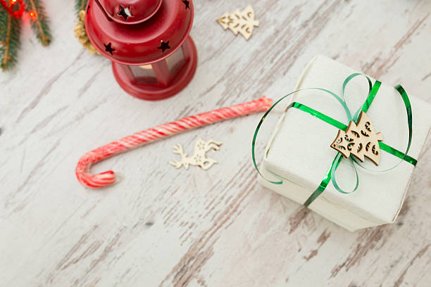 christmas presents wrapping and fir tree over wooden table background - new years eve christmas paper christmas fir tree imagens e fotografias de stock