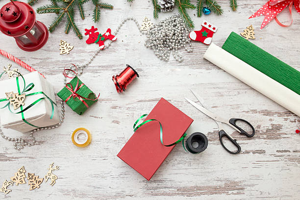 istock Christmas presents wrapping and fir tree over wooden table background 618061592