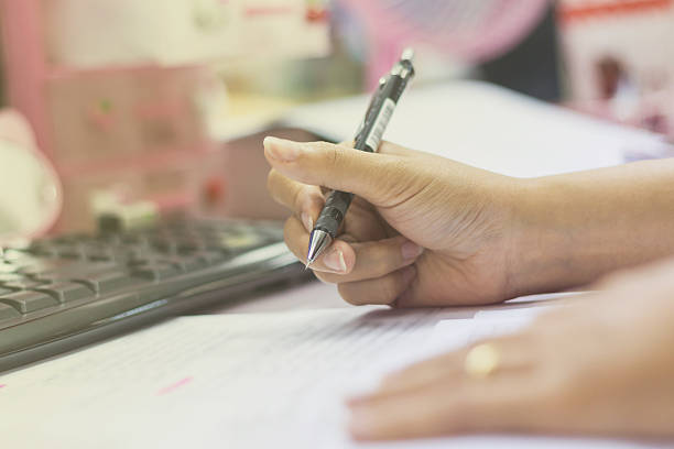 istock Businessman making notes on the paper in his office 618063596