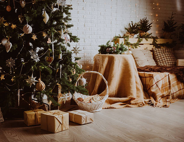 istock Christmas tree and presents in decorated living room 618064210