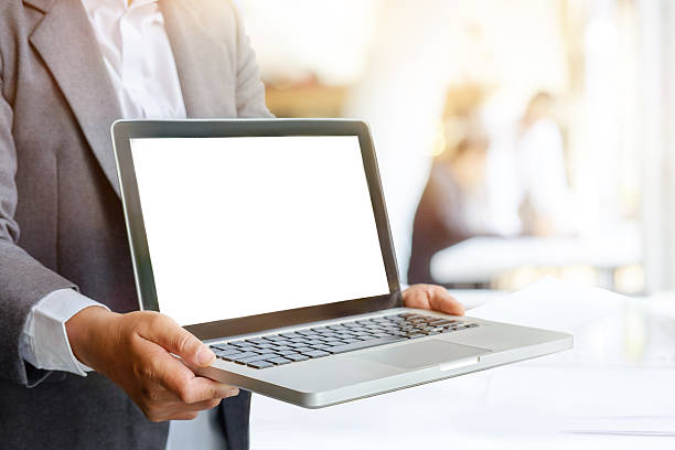 istock Business man showing blank screen on a laptop. 618064306