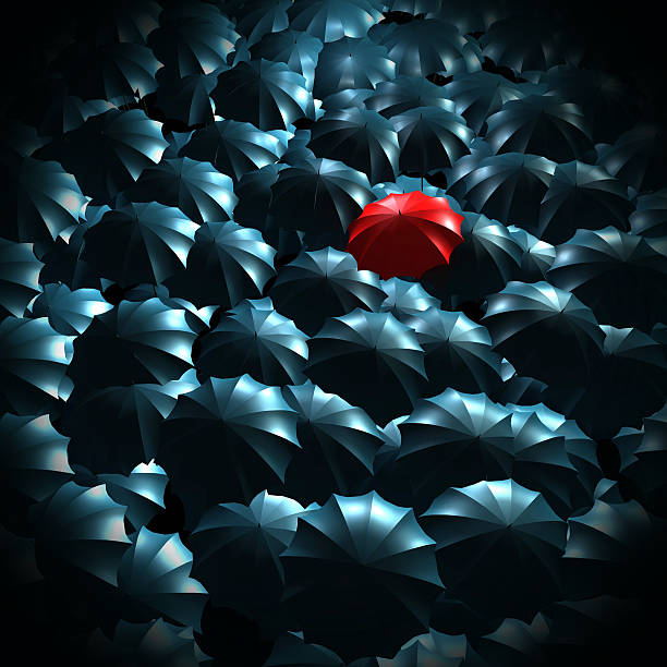 istock Standing out from the crowd concept with umbrellas 618067264