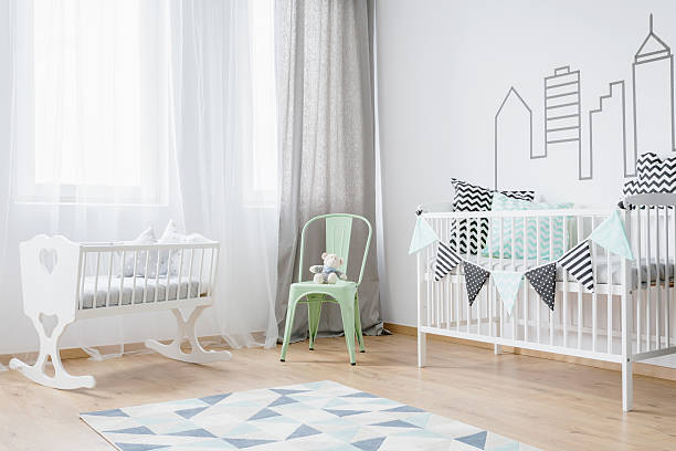 istock Bright baby room interior with wooden floor 618067630