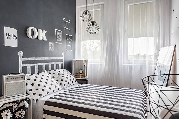 istock Small cozy black and white bedroom 618069410