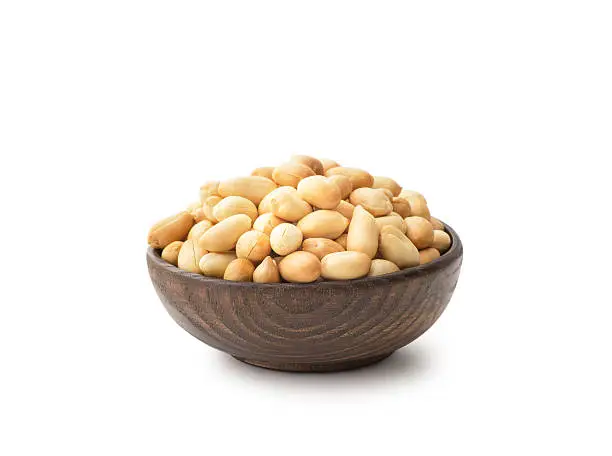 Peanuts with wooden bowl , isolated on white