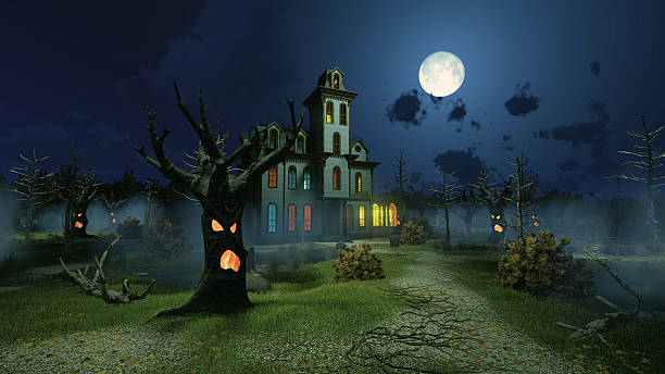 istock Scary mansion among creepy trees at night 618070802