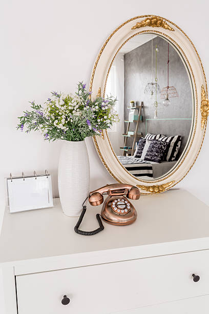 istock Beautiful mirror standing on a chest of drawers 618071134