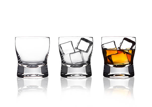 istock Glasss of whiskey with ice cubes with reflection 618178852