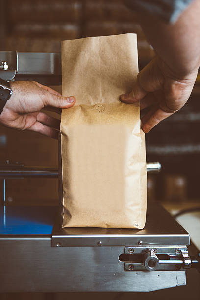 istock Person holding weighing coffee in bag 618179360