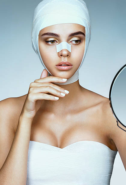 istock Beautiful Woman after plastic surgery 618181316