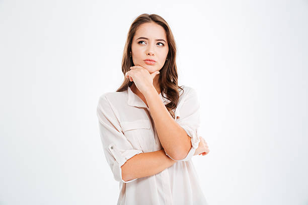 istock Thoughtful attractive young woman thinking and looking away 618184308