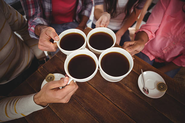 istock Group of friends toasting cup of coffee 618185774
