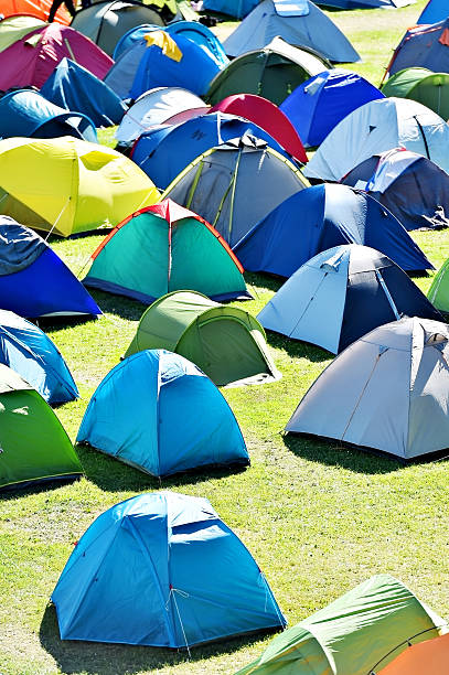 istock Lots of colorful tents in a camping 618186180