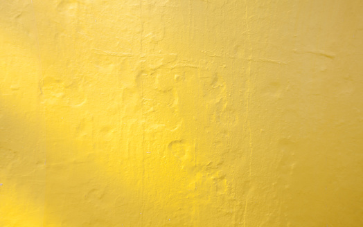 Wall painted yellow texture