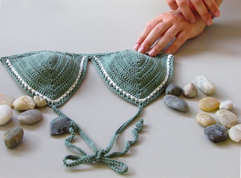Hand made knitting. Green crochet bikini pattern.