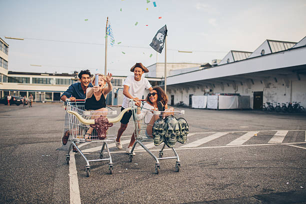 istock Young friends having fun on a shopping trolleys 618188956
