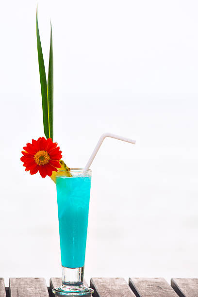 Blue Lagoon cocktail on the table at tropical beach