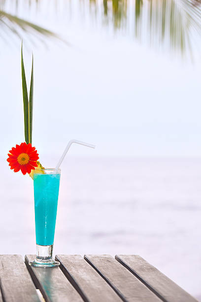 Blue Lagoon cocktail on the table at tropical beach
