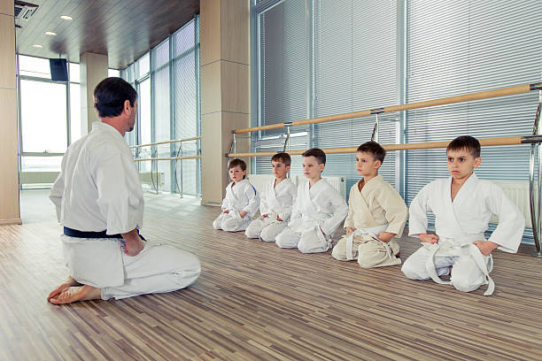 istock young, beautiful, successful multi ethical kids in karate positi 618190312