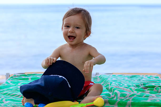 istock Cute baby on the beach 618193488