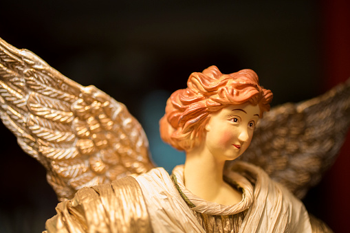 Close-up view of a Christmas angel figurine. Angel was mass-produced and purchased at a retail box store and it is not original artwork.