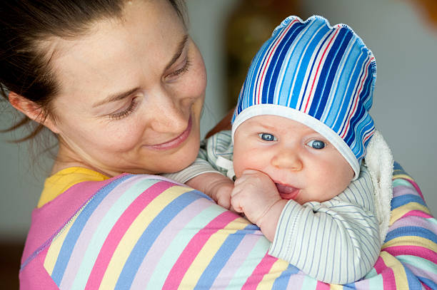 istock young mother with baby in her arms 618194632