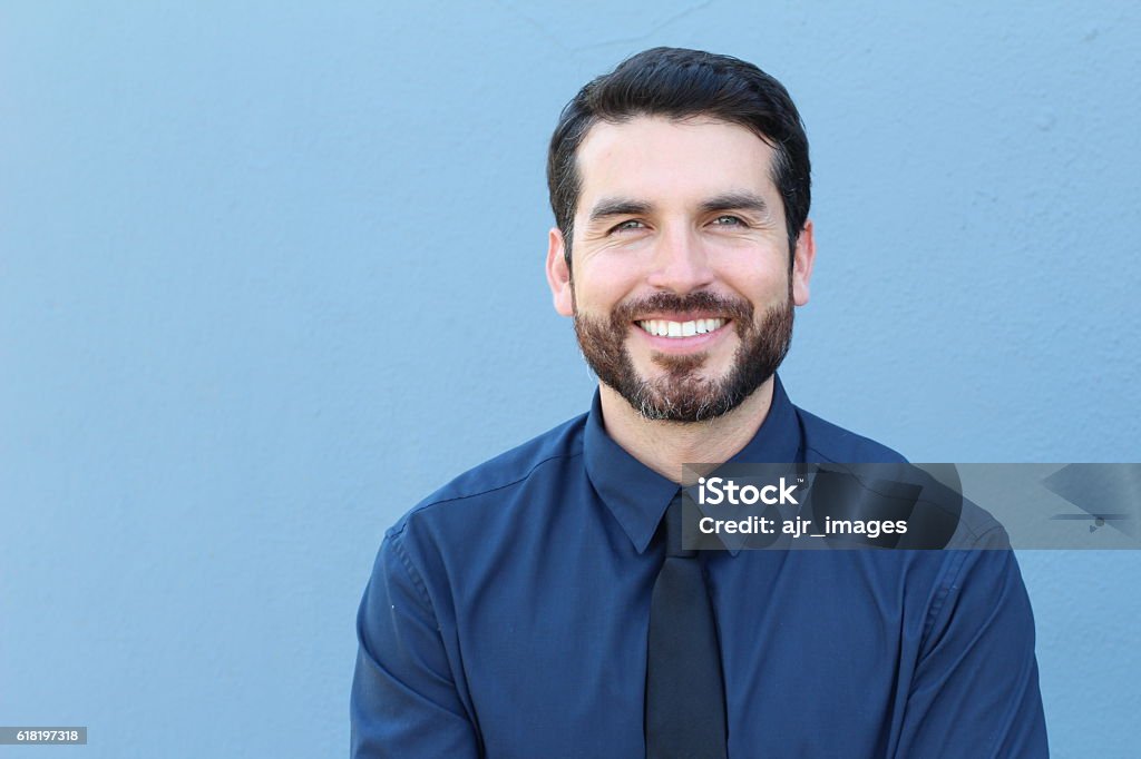 Proud Good Lookng Italian Businessman Smiling Proud Italian Businessman smiling in front of his office. He is a successful man with a lot of leadership. Suit Stock Photo