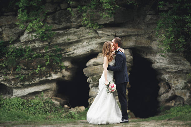 istock Happy wedding couple hugging and smiling each other on the 618198282