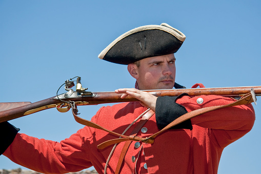 A reenactor portraying a British soldier in JBealls Company of the Maryland Forces during the French and Indian war.  This was a war fought between Great Britain and France in North America from 1754 to 1763.  In Canada, this war might be referred to as the Seven Years' War, although French speakers in Quebec often call it La guerre de la Conquête (\