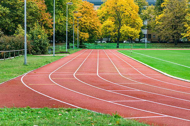 istock running track on a football field 618200196