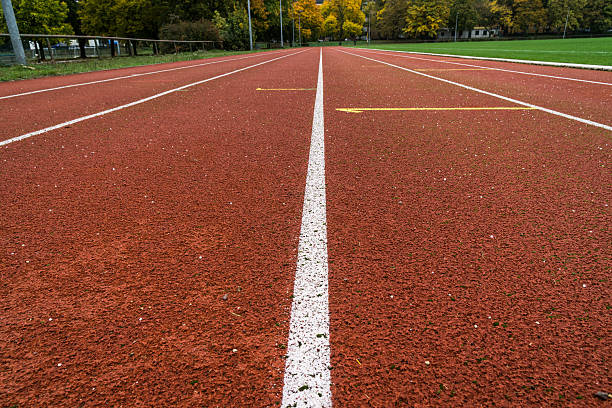 istock running track on a football field 618200352