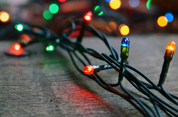 istock Christmas garland lights on wooden rustic background. 618200556