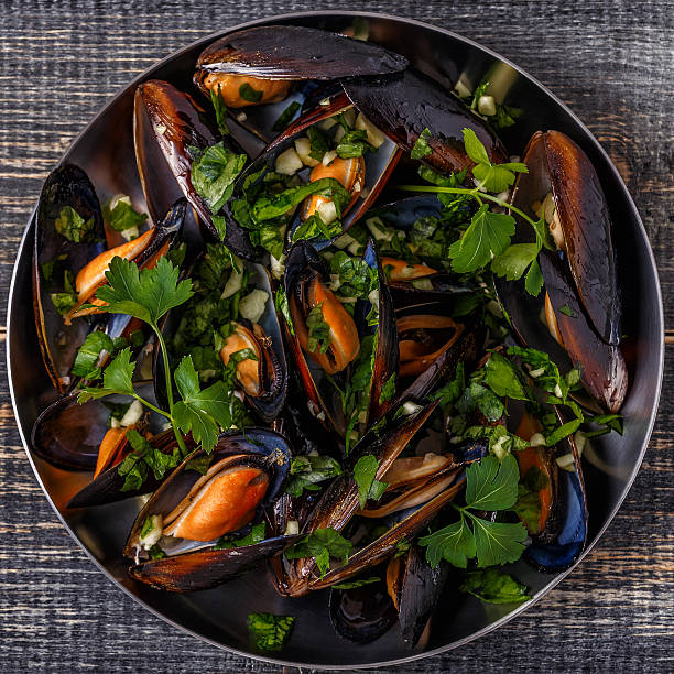 istock Boiled mussels in pan cooking dish. 618200858