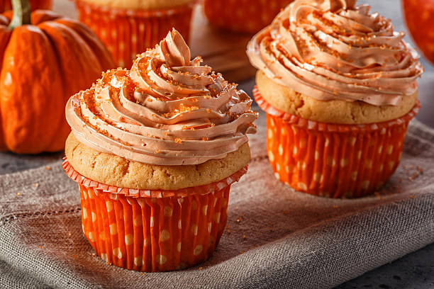 istock Pumpkin cupcakes with glitter sugar sprinkles. 618201104