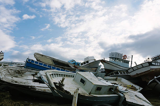 Stacked boat parts in junkyard