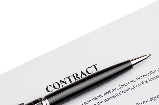istock Close-up of pen on contract 618208028