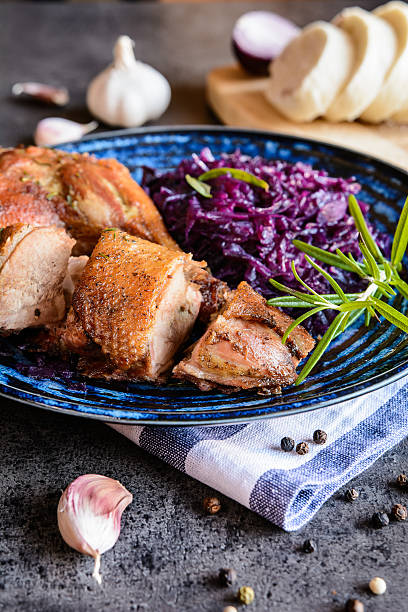 istock Roasted duck with stewed red cabbage and dumplings 618208502
