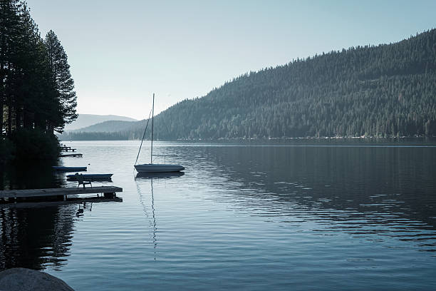 istock Small sailboat waiting at the end of the dock 618210012