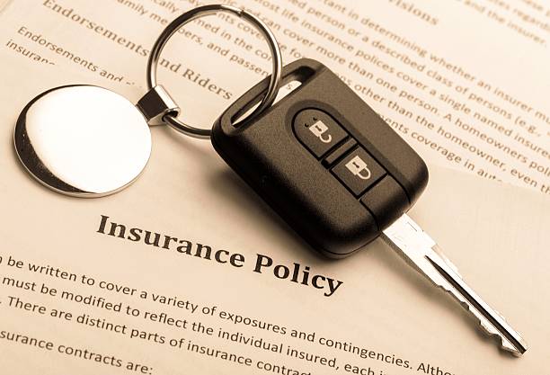 Insurance Car Key on an Insurance Policy car insurance photos stock pictures, royalty-free photos & images