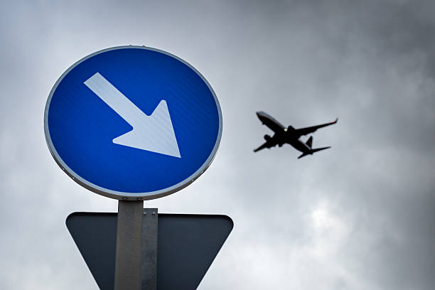 istock The plane in the cloudy sky. 618211980