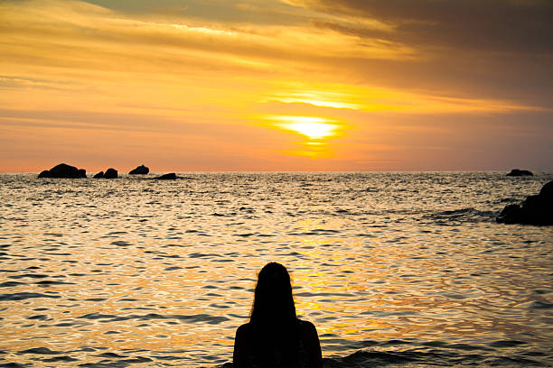 istock Girls contemplating sunset 618212292