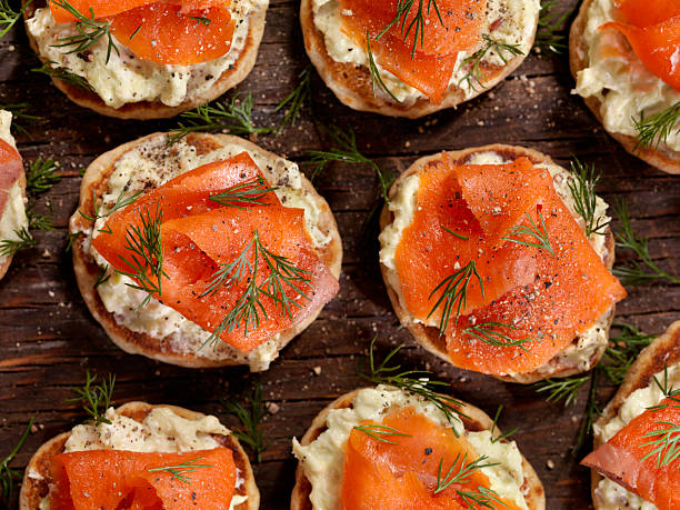 Smoked Salmon Canapes with Avocado Cream Cheese Smoked Salmon Canapes with Avocado Cream Cheese and Fresh Dill  -Photographed on Hasselblad H3D2-39mb Camera smoked salmon stock pictures, royalty-free photos & images