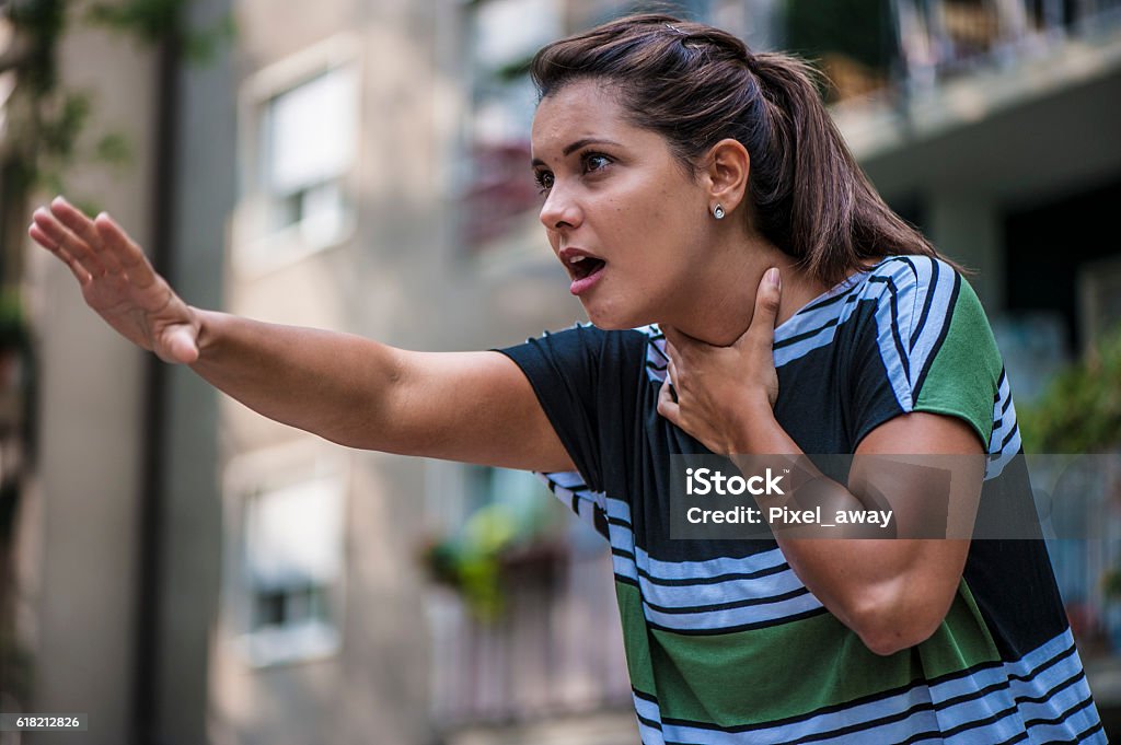 Calling for help A girl is in need  Heimlich Maneuver Stock Photo