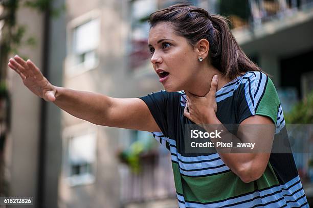 Calling For Help Stock Photo - Download Image Now - Heimlich Maneuver, Suffocated, A Helping Hand