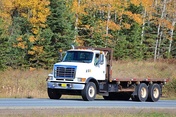 istock Truck on a highway, trees in background. 618212956