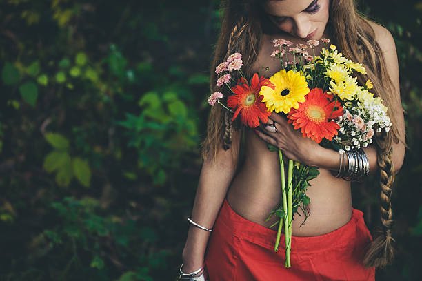istock Beautiful woman with flowers 618213196