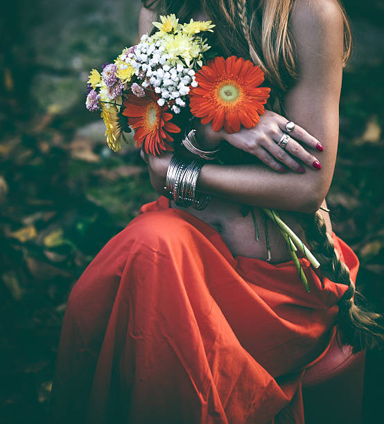 istock Beautiful woman with flowers 618213418