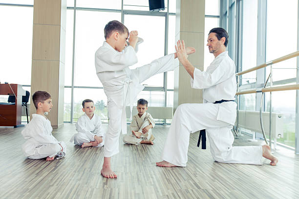 istock young, beautiful, successful multi ethical kids in karate positi 618213854
